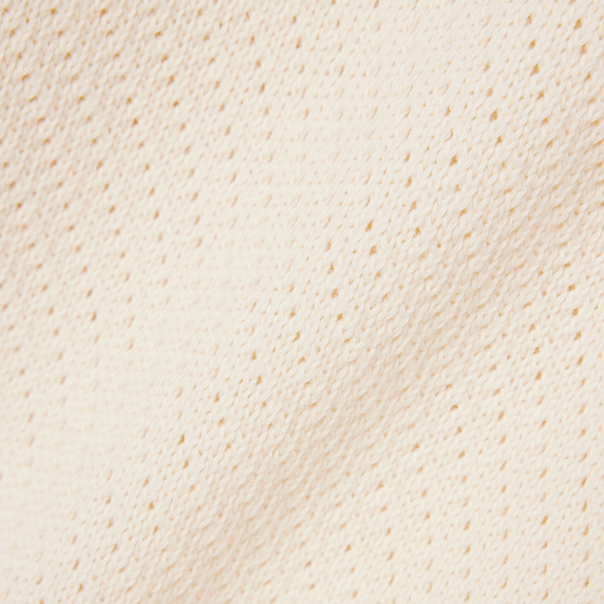 メッシュニットボタンレスポロシャツ